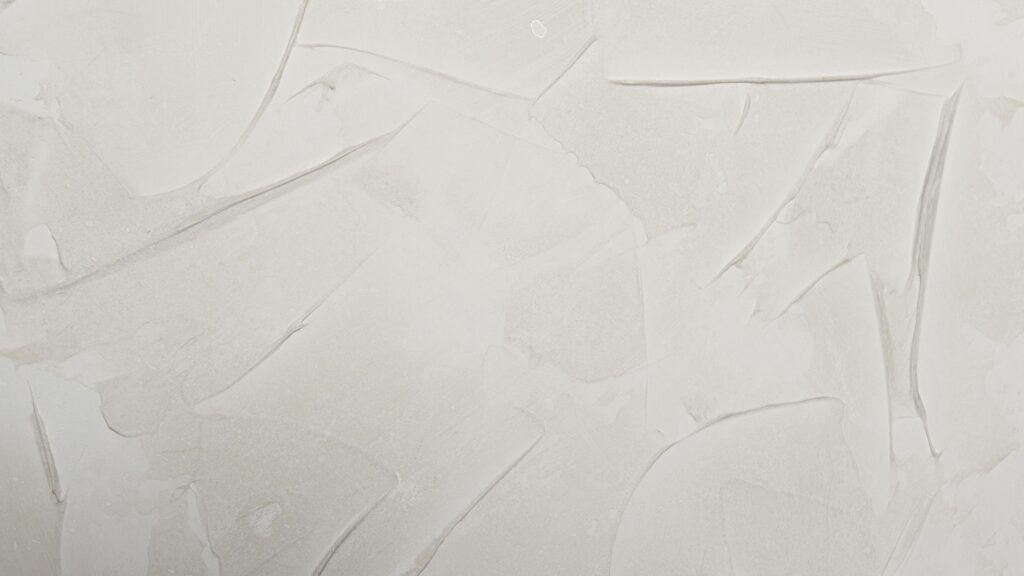 pexels-photo-7232830-7232830-1 Cream textured abstract wall pattern ideal for backgrounds and design elements.